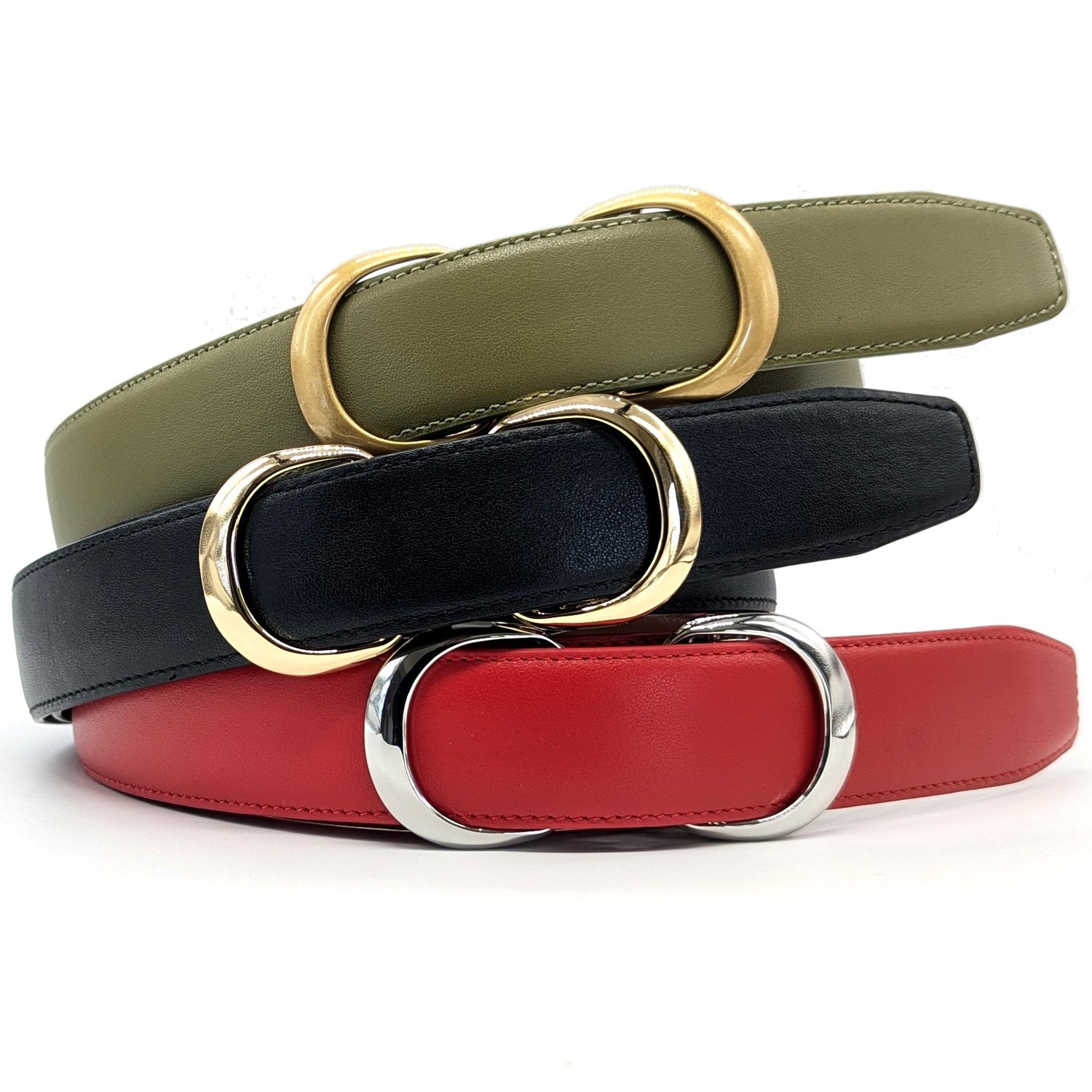 Three leather belts from Stanhope Belts 
in olive green, black, and red, coiled and stacked together.